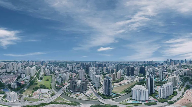 Photograph of the area, for illustration only: a 360-degree drone photograph taken at the height of the Sky Peak roof level above the site, showing the city in every direction