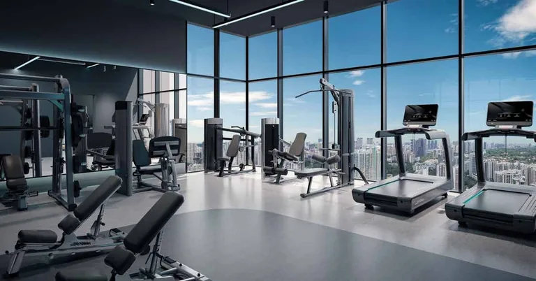 Promenade Peak, artist’s impression: the gymnasium of the Wellness Peak on the 43rd storey, with treadmills and weights before full-height windows